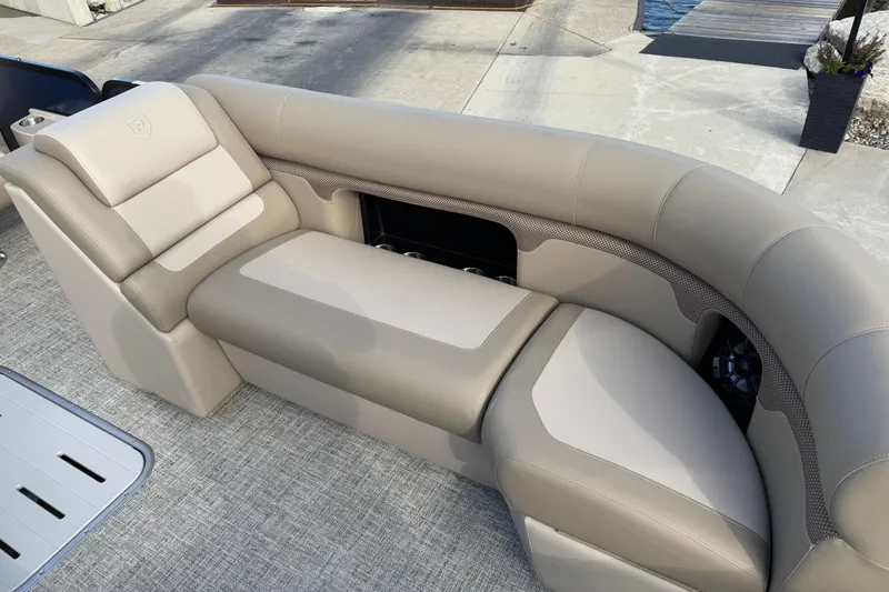 Slide: The Image of Luxurious seating on 2026 Premier 230 SunSation RF pontoon boat, featuring elegant beige upholstery. - 21