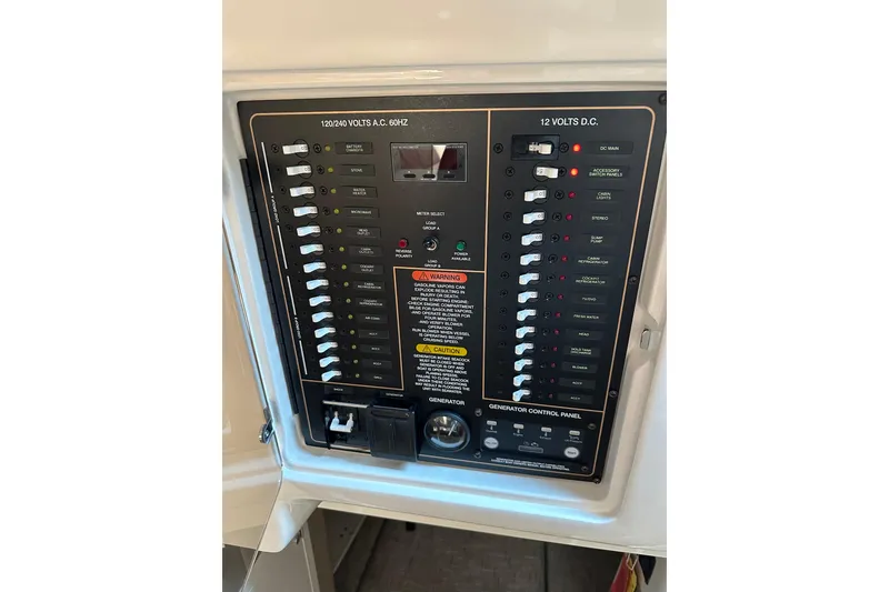 Slide: The Image of Electrical control panel on a 2017 Grady-White Express 330 boat. - 11