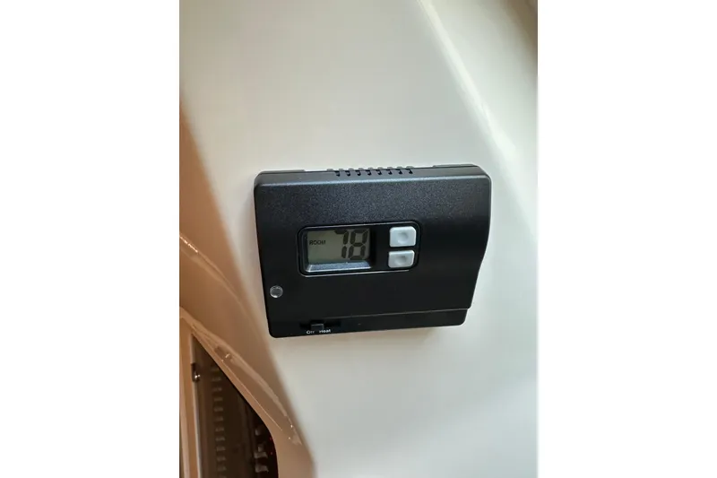 Slide: The Image of Digital thermostat on 2017 Grady-White Express 330 boat interior. - 12