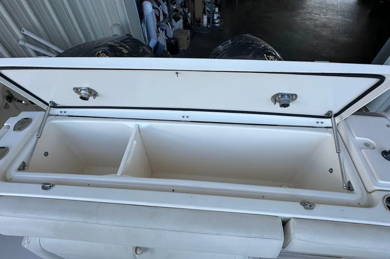 Slide: The Image of Open storage compartment on a 2017 Grady-White Express 330 boat, showcasing interior space. - 17