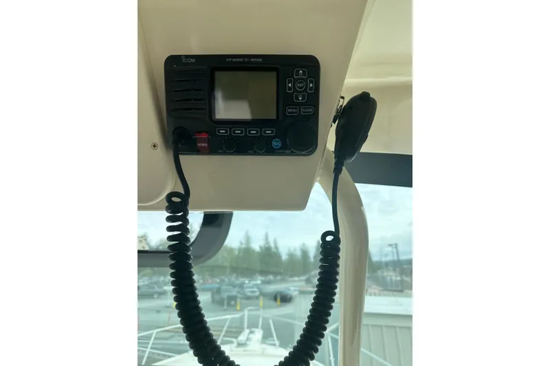 Slide: The Image of VHF marine radio on 2017 Grady-White Express 330 boat dashboard. - 25
