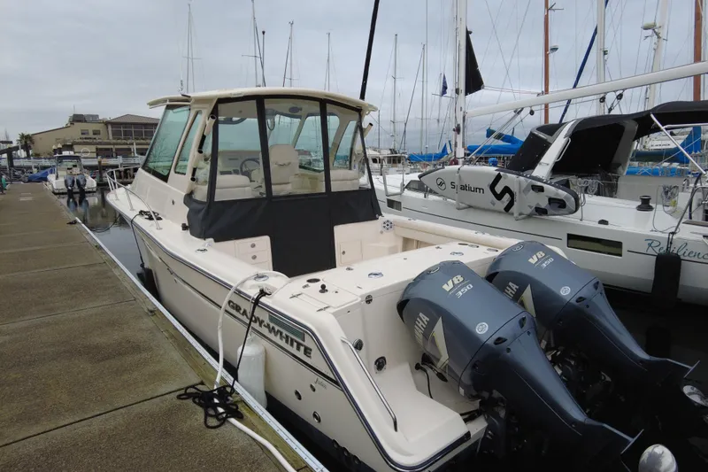 Slide: The Image of 2017 Grady-White Express 330 boat docked with twin Yamaha V8 engines. - 5