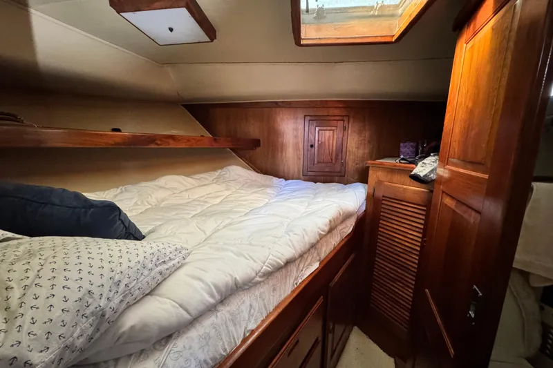 Slide: The Image of Cozy cabin interior of 1987 Californian 43 Cockpit MY yacht with wooden accents. - 13
