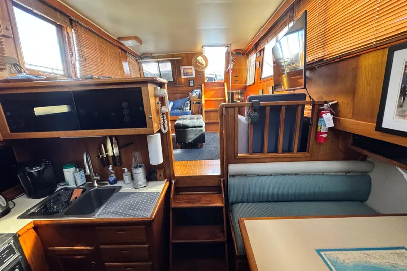 Slide: The Image of Interior of 1987 Californian 43 Cockpit MY yacht with kitchen and seating area. - 15
