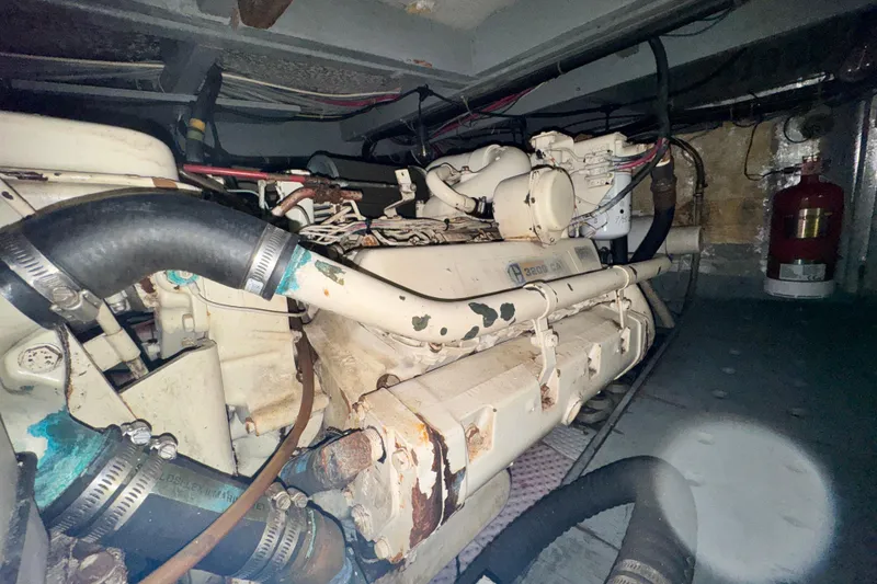 Slide: The Image of Engine room of 1987 Californian 43 Cockpit MY yacht, featuring a diesel engine. - 25