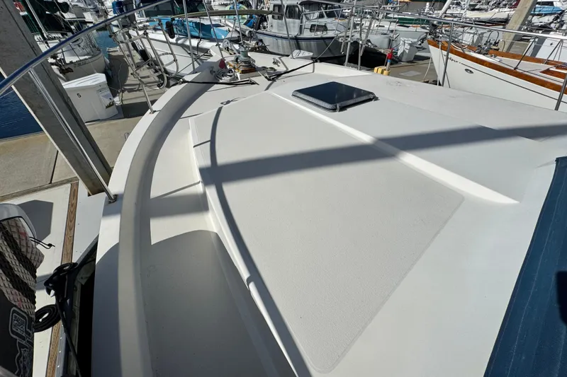 Slide: The Image of 1987 Californian 43 Cockpit MY yacht deck, docked at marina, showcasing sleek design. - 29