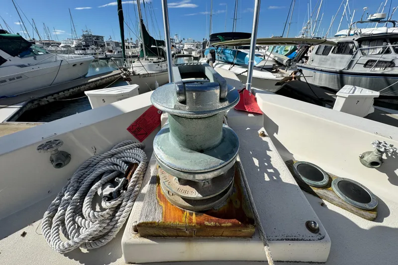 Slide: The Image of 1987 Californian 43 Cockpit MY yacht deck with winch and coiled rope in marina. - 30
