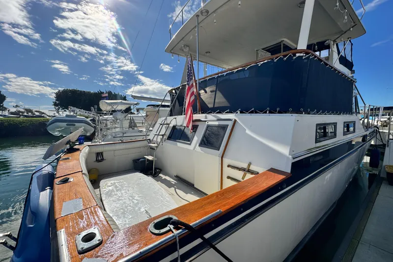 Slide: The Image of 1987 Californian 43 Cockpit MY yacht docked under a sunny sky. - 4