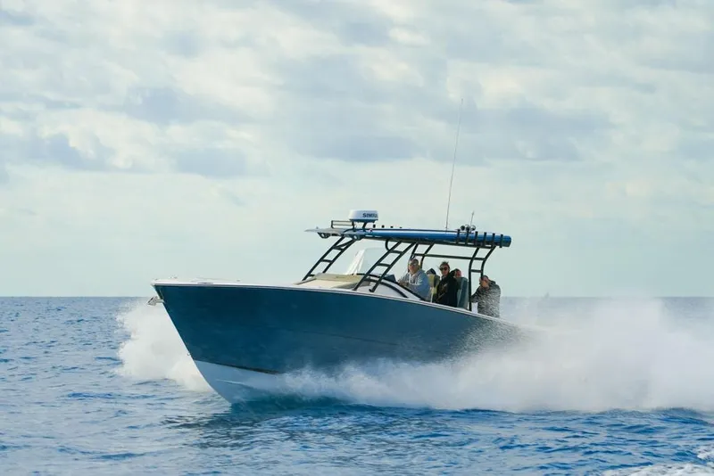 Slide: The Image of 2025 SeaWell 345XL boat cruising on open water with passengers onboard. - 14