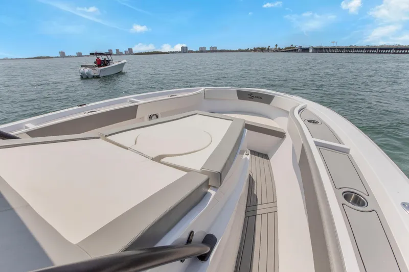 Slide: The Image of 2025 SeaWell 345XL boat with spacious deck, cruising on open water under clear skies. - 19