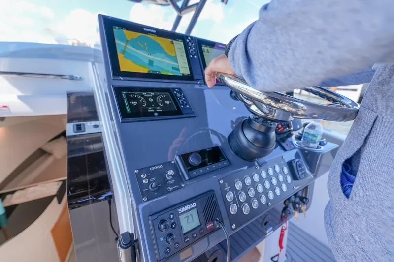 Slide: The Image of Person steering SeaWell 345XL boat with advanced navigation system, 2025 model. - 22