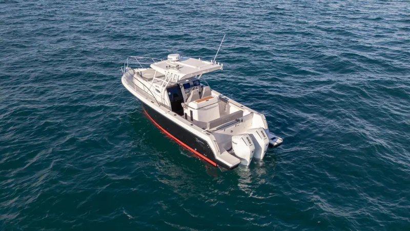 Slide: The Image of SeaWell 290XL boat cruising on open water, 2025 model. - 13