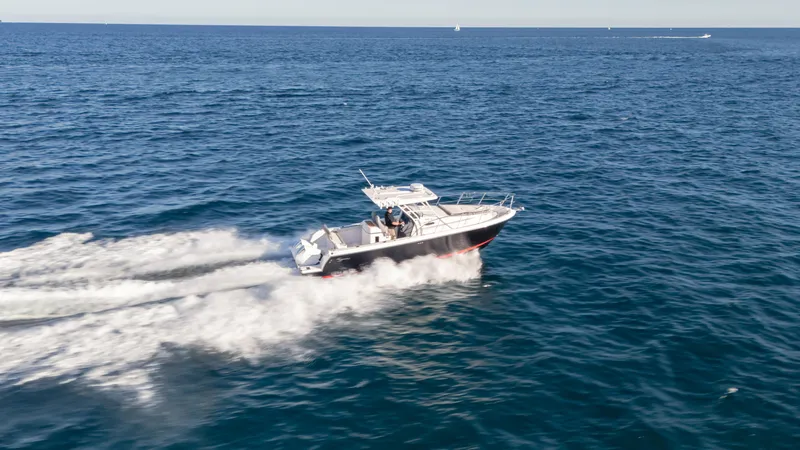 Slide: The Image of 2025 SeaWell 290XL boat speeding on open ocean waters. - 18