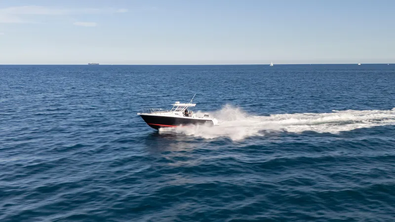 Slide: The Image of 2025 SeaWell 290XL speedboat cruising on open ocean under clear blue sky. - 21