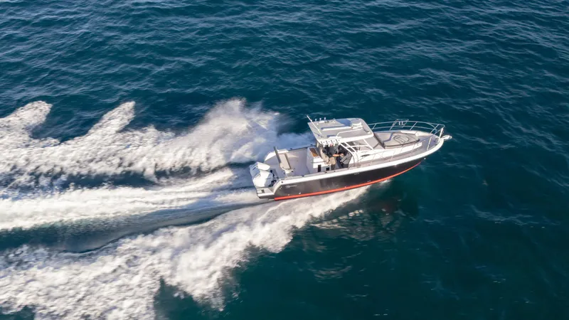 Slide: The Image of Aerial view of 2025 SeaWell 290XL boat cruising on open water. - 26