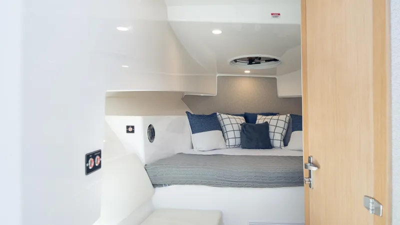 Slide: The Image of Interior cabin of 2025 SeaWell 290XL boat with cozy bedding and modern design. - 30