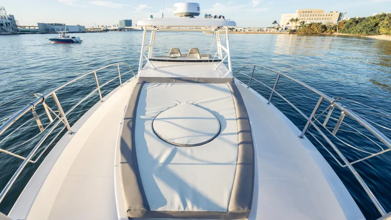 Slide: The Image of 2025 SeaWell 290XL yacht on calm water, featuring spacious deck and modern design. - 32