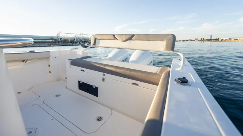 Slide: The Image of 2025 SeaWell 290XL boat interior with seating, overlooking calm waters and distant shoreline. - 33
