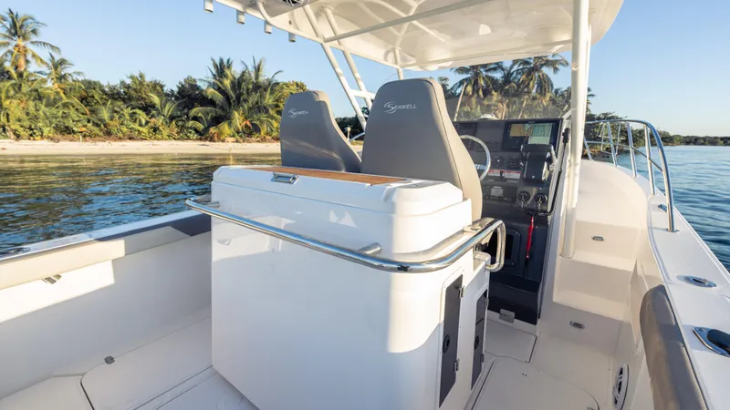 Slide: The Image of Modern SeaWell 290XL boat interior, 2025 model, near tropical shoreline. - 34