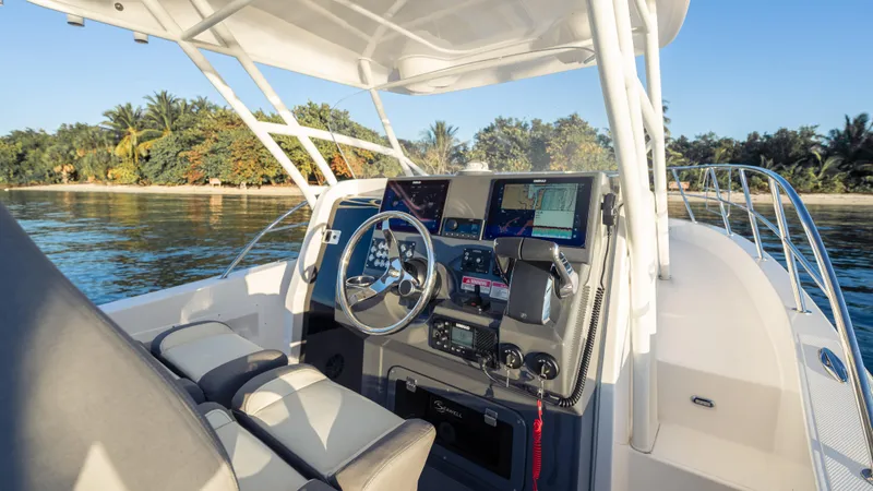Slide: The Image of 2025 SeaWell 290XL boat cockpit with modern navigation equipment, steering wheel, and comfortable seating. - 39