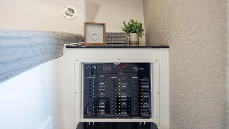 Slide: The Image of Electrical panel inside a 2025 SeaWell 290XL boat, with decor and ventilation. - 7