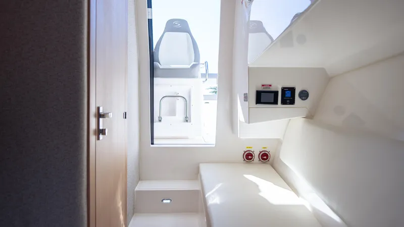 Slide: The Image of Interior cabin of 2025 SeaWell 290XL boat, featuring modern controls and seating. - 8