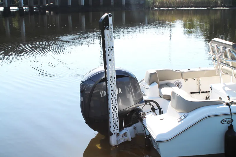 Slide: The Image of 2024 Key West 203 FS boat with Yamaha outboard motor on calm water. - 10