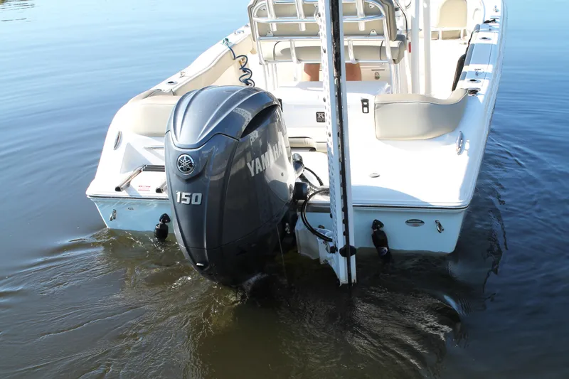 Slide: The Image of 2024 Key West 203 FS boat with Yamaha 150 engine on calm water. - 11