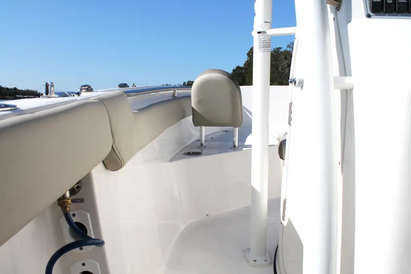 Slide: The Image of 2024 Key West 203 FS boat interior with beige seating and white deck. - 21