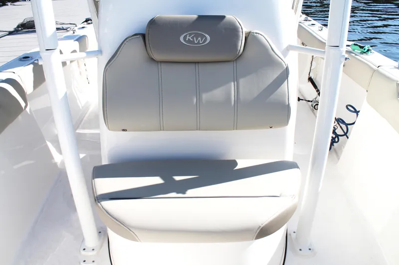 Slide: The Image of 2024 Key West 203 FS boat seat with gray upholstery and KW logo. - 23