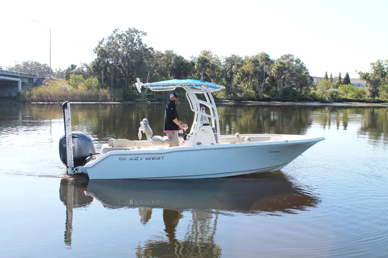 Slide: The Image of 2024 Key West 203 FS boat on calm river with trees in background. - 3
