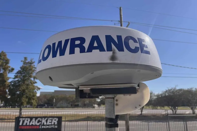 Slide: The Image of Lowrance radar on a 1997 Gravois 20CC boat, clear sky background. - 11