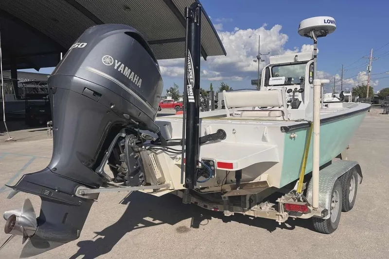 Slide: The Image of 1997 Gravois 20CC boat with Yamaha outboard motor on a trailer. - 3