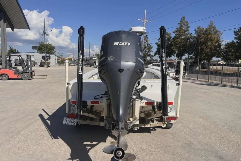 Slide: The Image of 1997 Gravois 20CC boat with Yamaha 250 outboard motor in a parking lot. - 4
