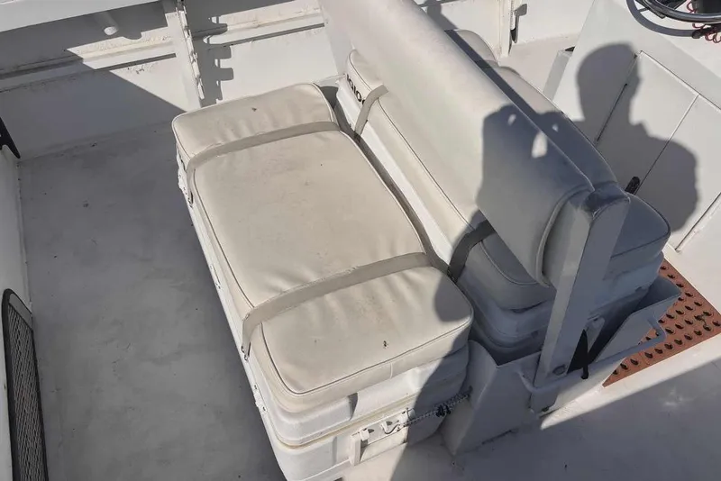 Slide: The Image of 1997 Gravois 20CC boat interior with cushioned seating and storage. - 5