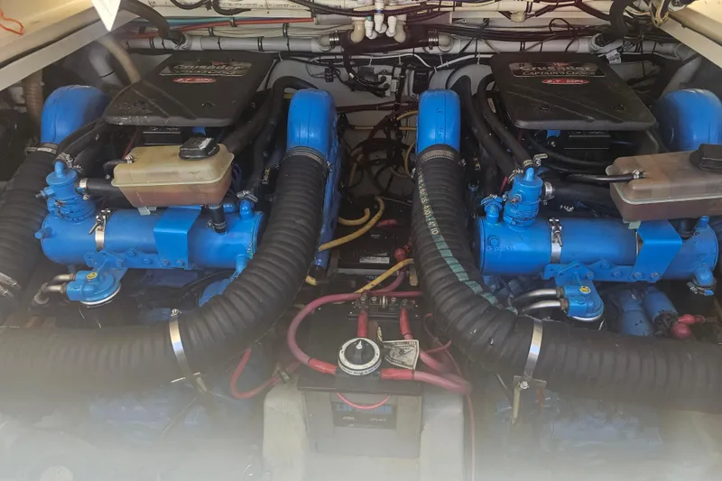 Slide: The Image of Twin Crusader engines in a 2001 Pursuit 3000 Express boat engine compartment. - 51