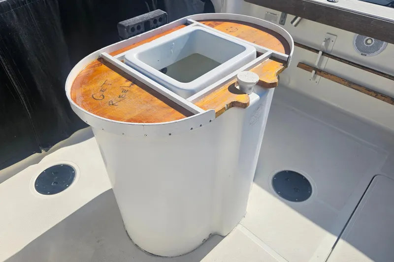 Slide: The Image of 2001 Pursuit 3000 Express boat with a custom fishing station on deck. - 7