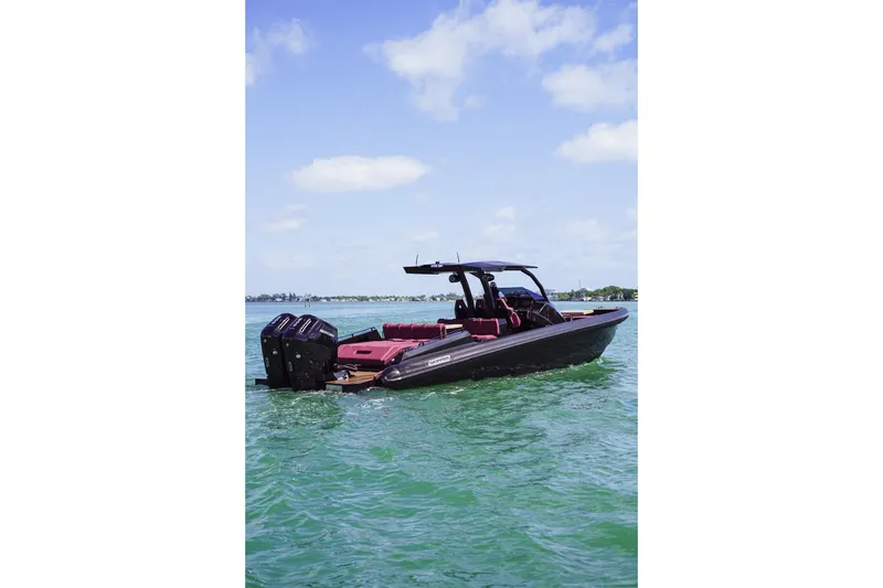 Slide: The Image of 2024 Skipper 42 boat on clear water, featuring sleek design and powerful engines. - 2