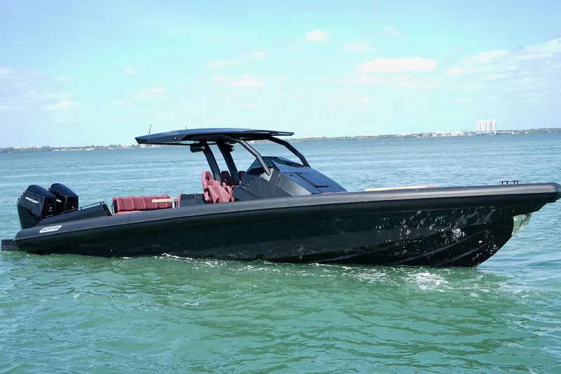 Slide: The Image of 2024 Skipper 42 boat cruising on calm blue waters under a clear sky. - 10