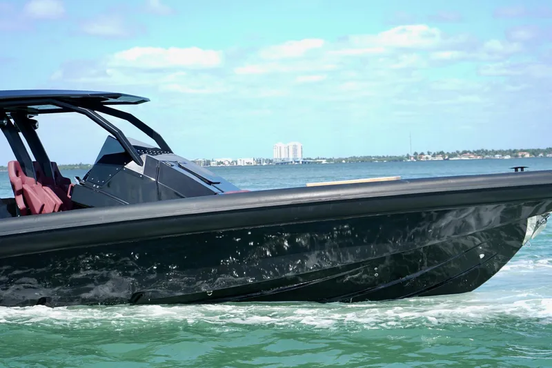 Slide: The Image of 2024 Skipper 42 boat cruising on clear blue waters, showcasing sleek design and luxury. - 19