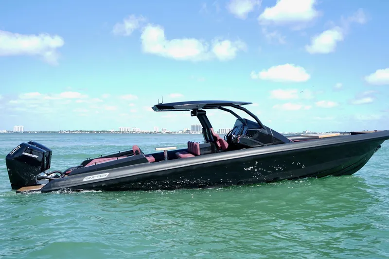 Slide: The Image of 2024 Skipper 42 boat cruising on clear blue waters under a sunny sky. - 20