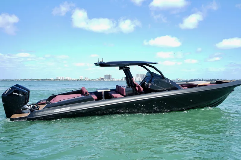 Slide: The Image of 2024 Skipper 42 boat on water, sleek design, sunny day, city skyline background. - 21