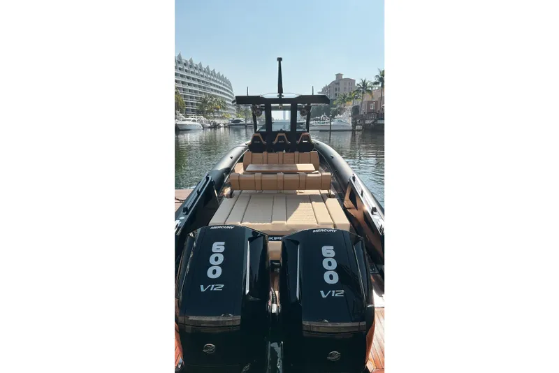 Slide: The Image of Luxury Skipper 42 boat, 2024 model, with dual Mercury 600 V12 engines docked in a marina. - 3