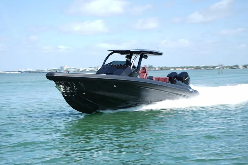 Slide: The Image of 2024 Skipper 42 speedboat cruising on clear blue water. - 34