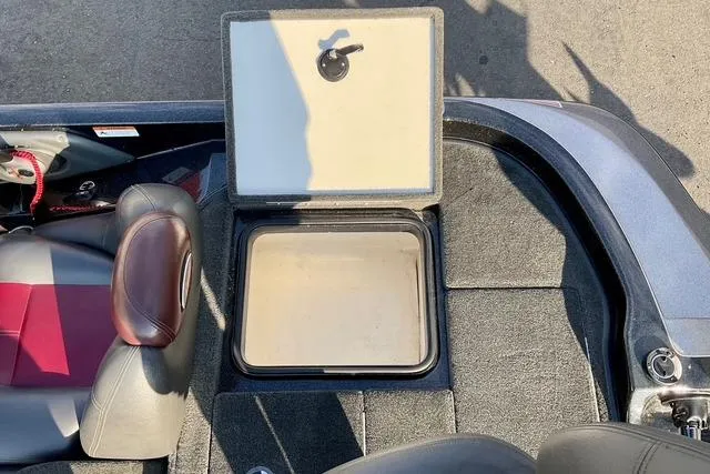 Slide: The Image of 2008 Ranger 188 VX boat interior with open storage compartment and seating. - 10