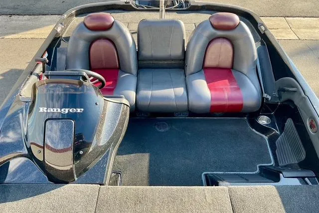 Slide: The Image of 2008 Ranger 188 VX boat interior with gray and red seating, steering console visible. - 13