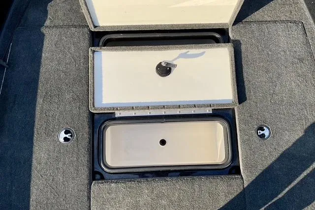Slide: The Image of 2008 Ranger 188 VX boat storage compartment with open lid, showing interior details. - 18