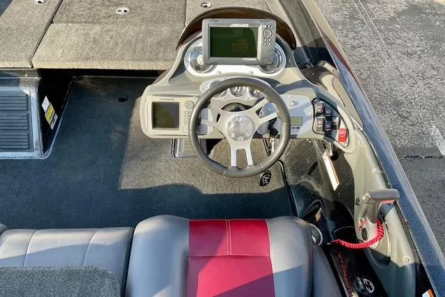 Slide: The Image of 2008 Ranger 188 VX boat cockpit with steering wheel and navigation system. - 21