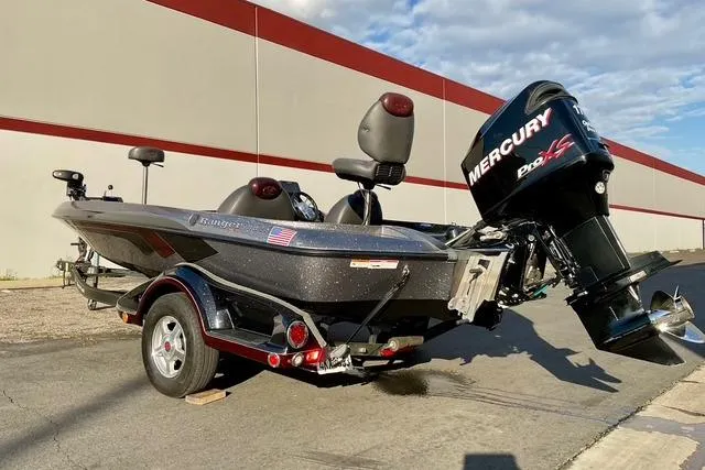 Slide: The Image of 2008 Ranger 188 VX boat with Mercury Pro XS engine, parked outdoors. - 7