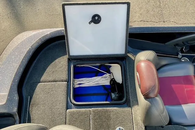 Slide: The Image of Open storage compartment in 2008 Ranger 188 VX boat, showing ropes and equipment. - 9